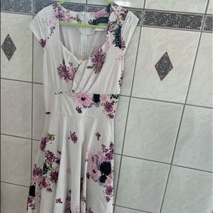Knee length dress. White with floral pattern. Worn once.